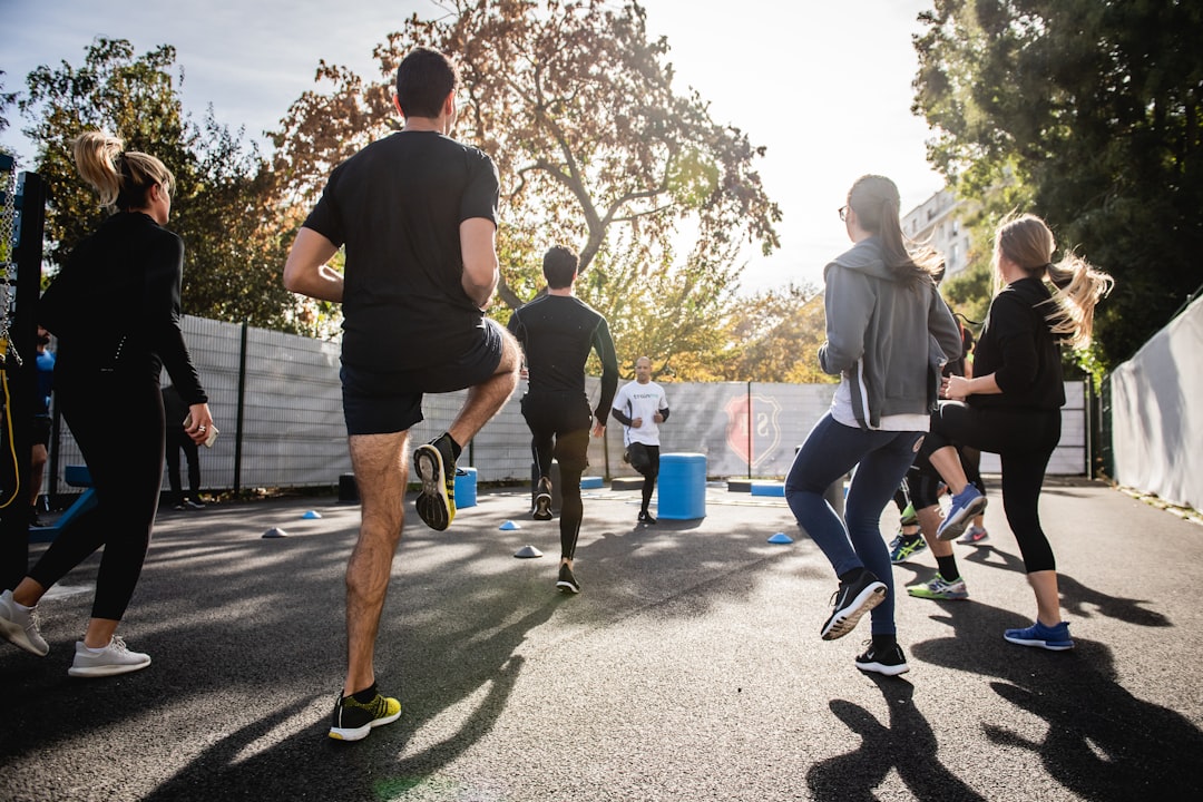 A person stretching after a workout in a serene outdoor setting, emphasizing relaxation and recovery.