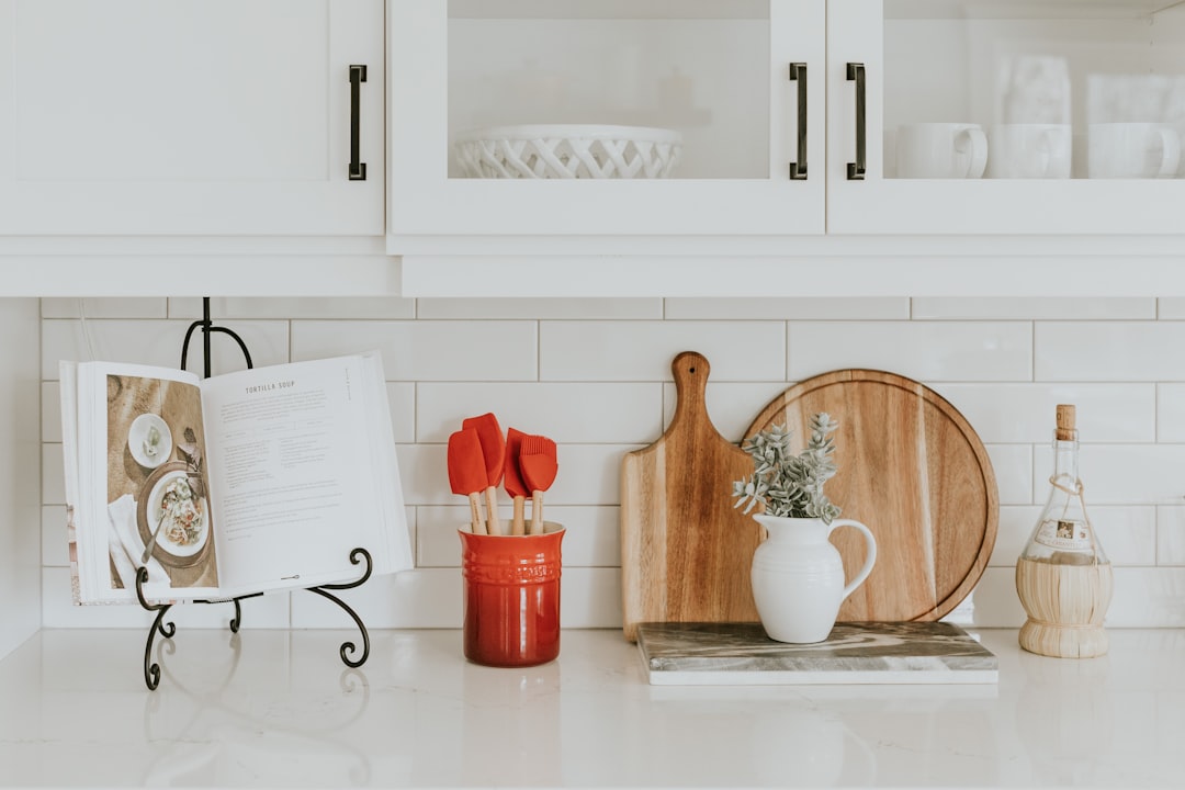 A collection of essential kitchen tools arranged on a countertop, showcasing various utensils, pots, and gadgets.