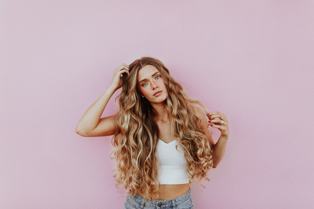 A close-up of damaged hair with split ends, highlighting the effects of poor hair care habits.